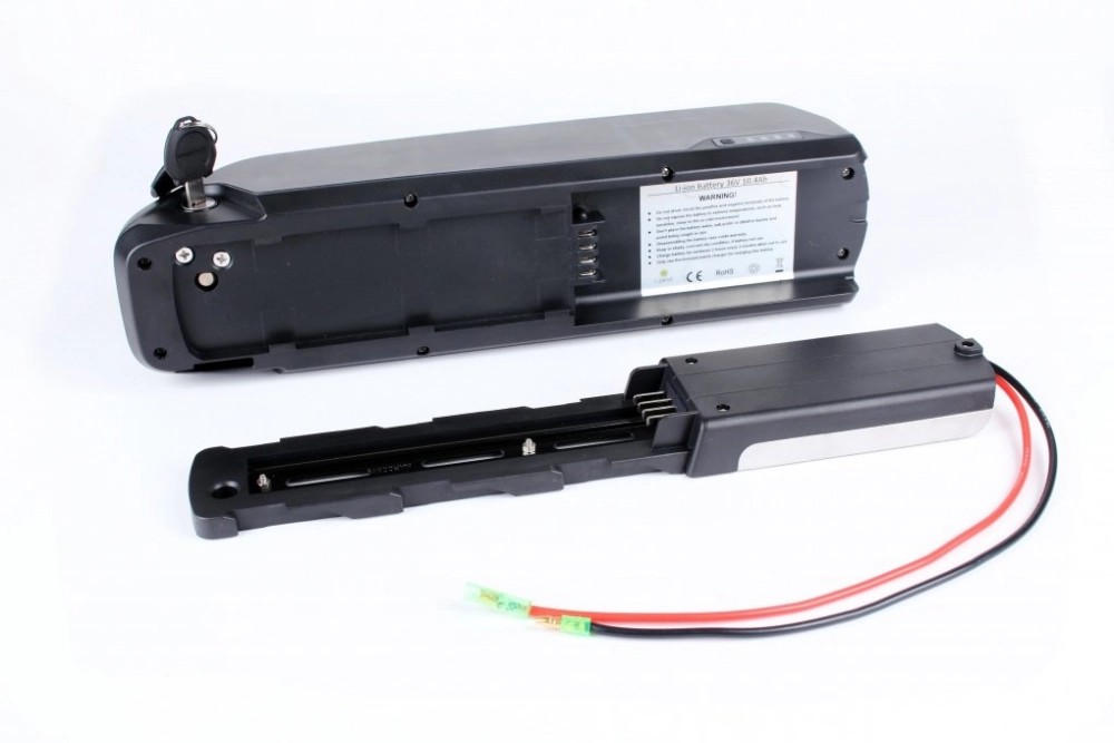 Accu 36v 14Ah PNL 5C wordt met name toegepast in elektrische bakfietsen en cargo bikes. De accu schuift op een slede welke is gemonteerd op of onder het frame. Om de accu op te laden wordt een acculader met output van 42 volt en DC2.1 connector toegepast. Specificaties Spanning: 36 volt Capaciteit: 14Ah / 504Wh Oplaadpunt: DC2.1 Afmetingen: ca. 368 x 95 x 125 mm. Discharge: 4 -pins